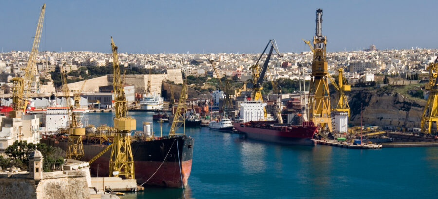 Cargo ships and harbor cranes at a commercial seaport